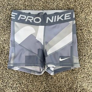 Multicolored blue Nike pros. Size XS. NEVER WORN!new shorts.